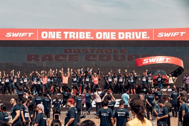 Concert crowd with One Tribe banner
